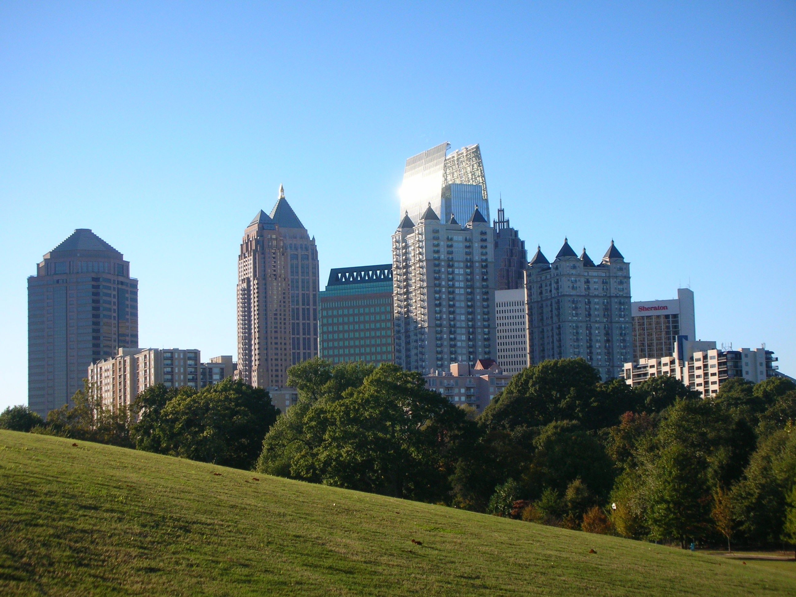 Midtown Atlanta skyline near Ansley Park apartments and Monroe Drive at Treeline Ansley